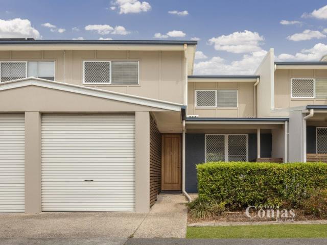 Quiet, yet Convenient Townhouse in a Sought After Complex