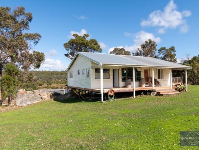Private 59 acre property with spring fed water, open paddocks and bushland a quiet rural setting to shape over time