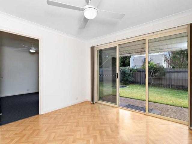 QUIET REAR VILLA WITH NEW CARPET, AIR CONDITIONING & GREAT YARD