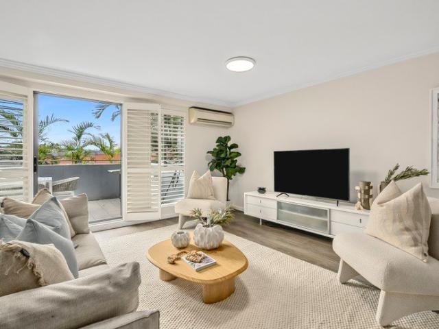 Quietly Positioned with Townhouse Scale Proportions
