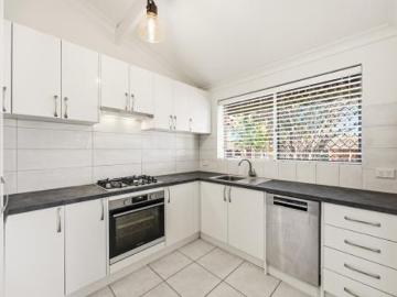 Raked Ceilings, Exposed Beams and a Courtyard You'll Never Want to Leave