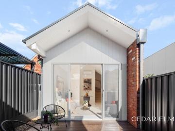 Rare Bayside Residence with Garage in Premier Waterfront Location