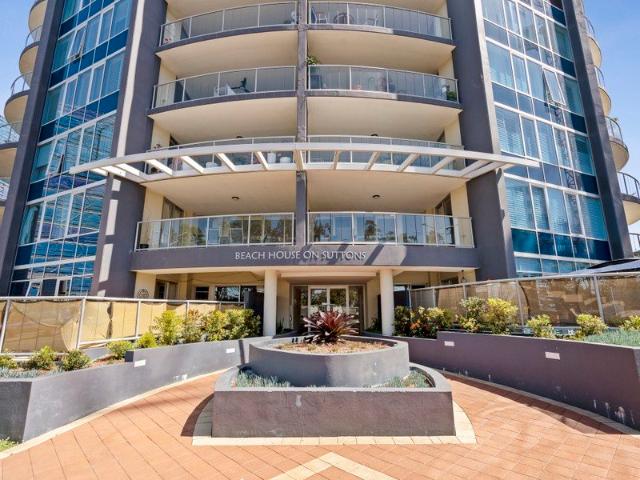 Rare Coastal Ground Floor Residence with Mobility Friendly Features Directly Across from Suttons