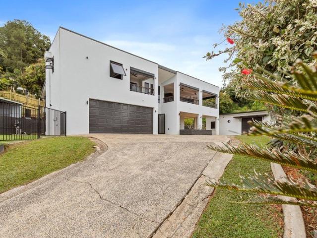 RARE ELEVATED ESTATE WITH PANORAMIC CITY AND GREEN ISLAND VIEWS