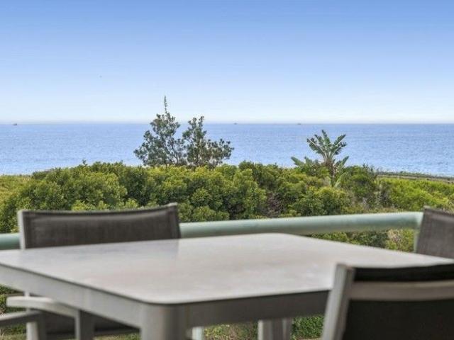 RARE ABSOLUTE BEACHFRONT TOWNHOUSE WITH SWEEPING OCEAN VIEWS