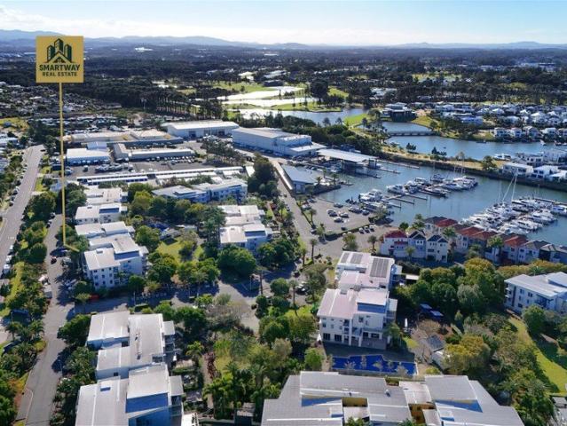 Rare GroundFloor Living with Two Outdoor Areas in a Premium Hope Island Precinct