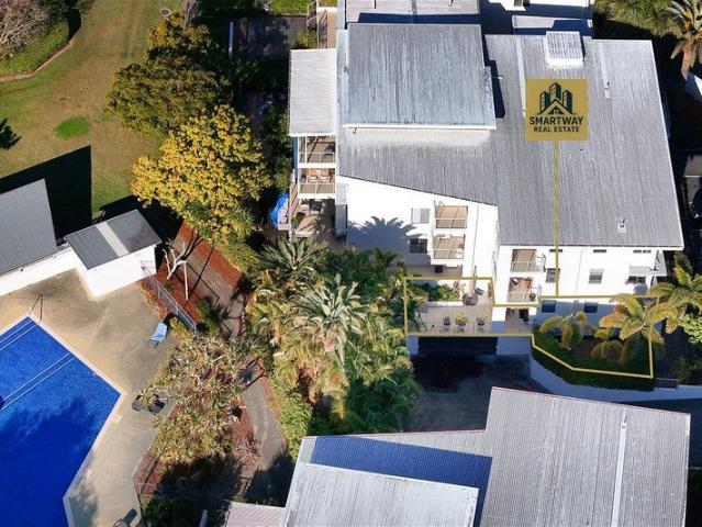 Rare GroundFloor Living with Two Outdoor Areas in a Premium Hope Island Precinct
