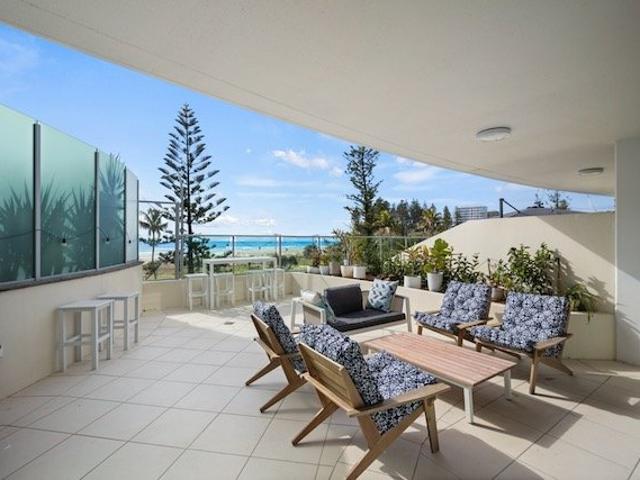 Rare Podium Level Beachfront Living with Exceptional Outdoor Space
