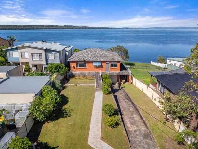 Rare Sandy Waterfront Opportunity