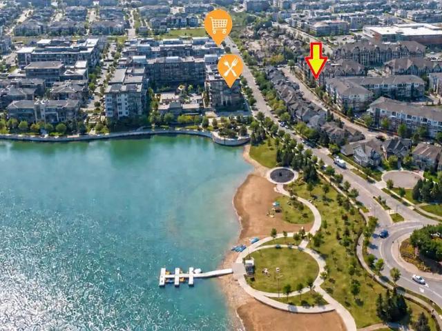 RARE TOP FLOOR CONDO | STEPS TO LAKE | HEATED UNDERGROUND PARKING+STORAGE