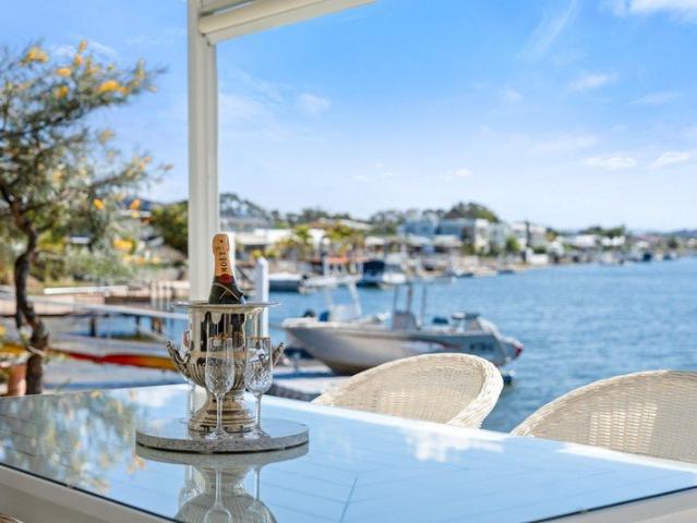 RARE WATERFRONT LIVING WITH SPECTACULAR CANAL VIEWS!
