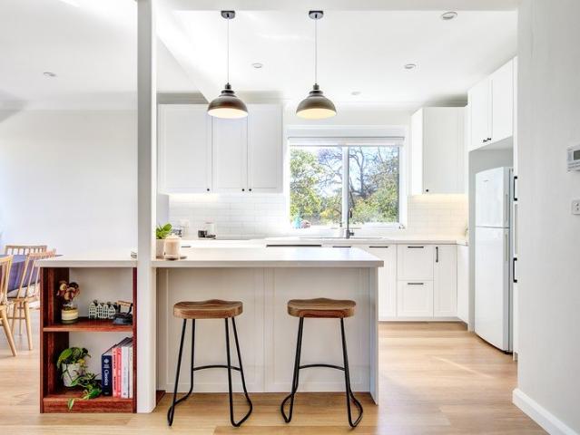 Rarely Found: Exceptionally private top floor luxury with triple garage & panoramic district views