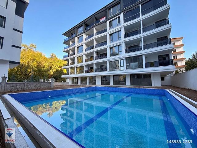 REMAX TANER DİLEK'TEN ÇAKIRLAR YALI'DA HAVUZLU SİTEDE SIFIR 1+1