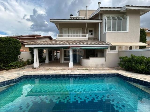 RE/MAX ALUGA CASA EM CONDOMÍNIO 3 SUÍTES 360 M² 4 VAGAS E PISCINA AQUECIDA R$ 15.000,00 BARÃO GERALDO CAMPINAS/SP