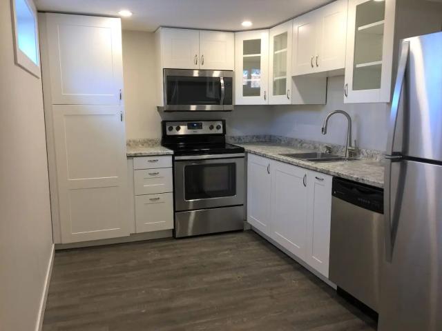 RENOVATED 2BR + den, bright and modern basement suite by Westbrook