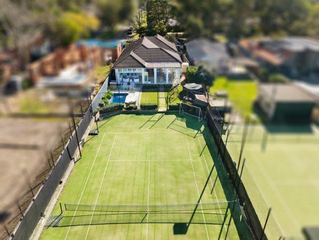Renovated Family Haven with Floodlit Tennis Court in a Sought After Location