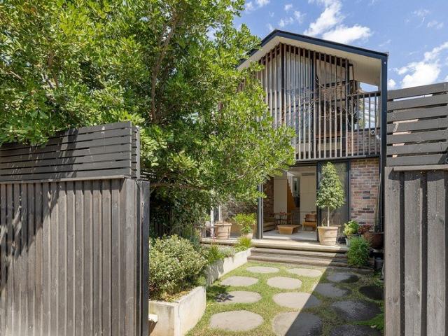 Renovated freestanding home with striking NE facing extensions