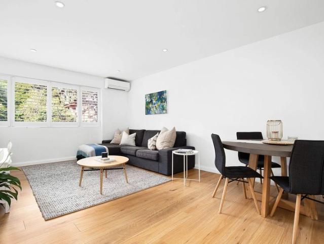 Renovated full brick classic enjoys a rear position with garden views