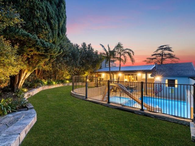 Renovated mid century masterpiece with resort style living and Oyster Bay views with pool and garden maintenance included