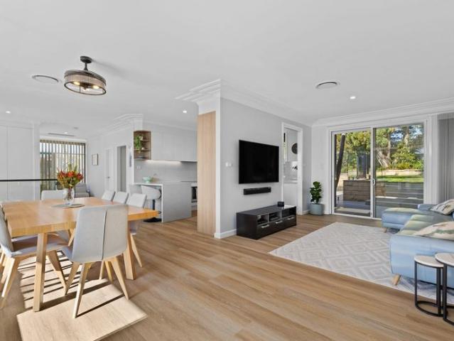 Renovated mid century masterpiece with resort style living and Oyster Bay views with pool and garden maintenance included
