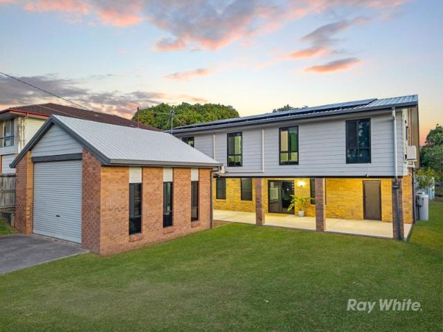 RENOVATED TO IMPRESS SPACE, STYLE AND SIDE ACCESS!
