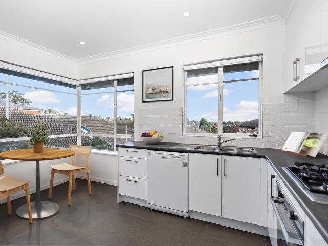 Renovated Three Bedroom Townhouse with Double Garage & Private Courtyard