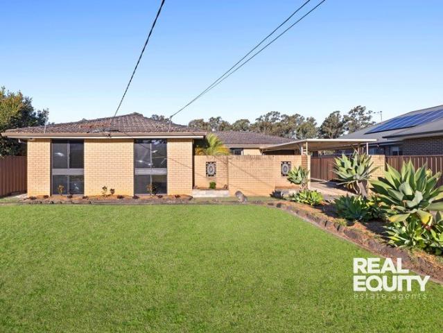 Renovated three bedroom double brick home with pool and development potential in Moorebank