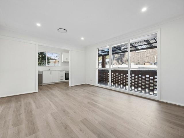 RENOVATED THREE BEDROOM HOME WITH EXPANSIVE SUN FILLED BACKYARD