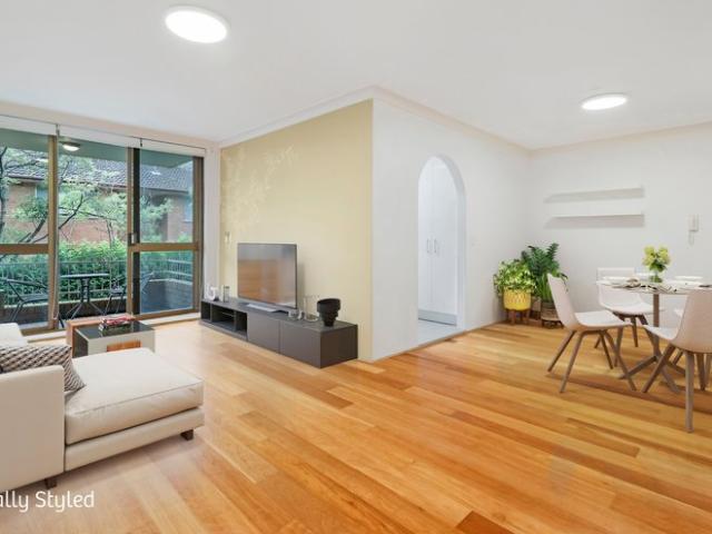 Renovated two bedroom apartment with leafy balcony and lock up garage