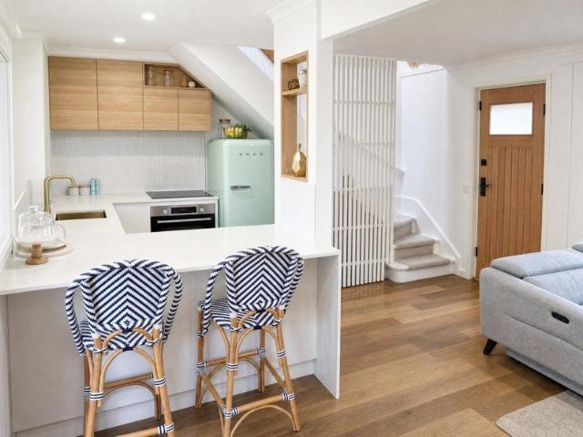 Renovated two bedroom townhouse with a private courtyard across the road from the beach!