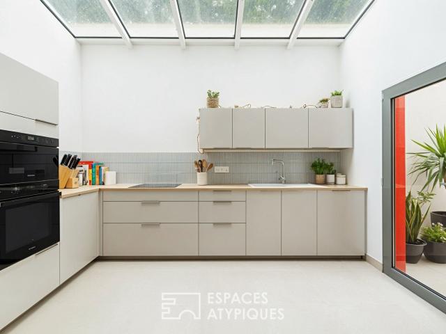 Rénovation de prestige sous verrière aux accents fifties 116m² Royan