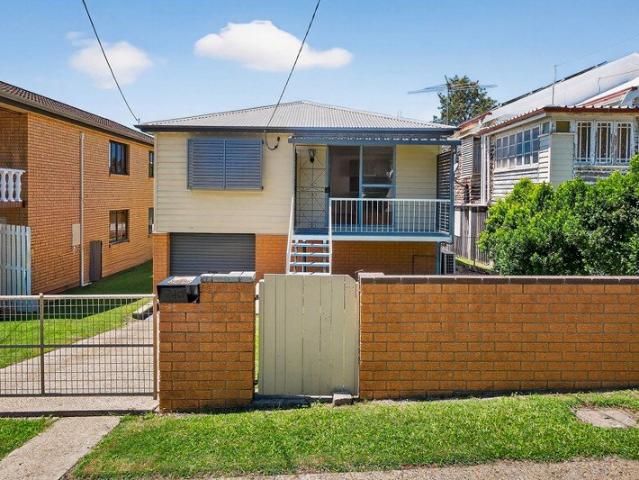 Renovator Opportunity with City Glimpses in Tightly Held Street