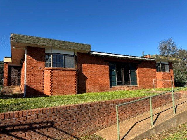 RENOVATOR'S DELIGHT WITH POOL & PLENTY OF POTENTIAL!