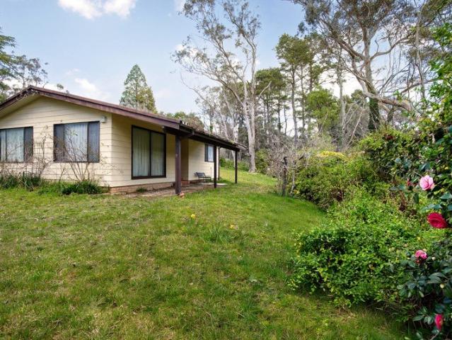 Renovator's Retreat in a Tranquil Creekside Setting