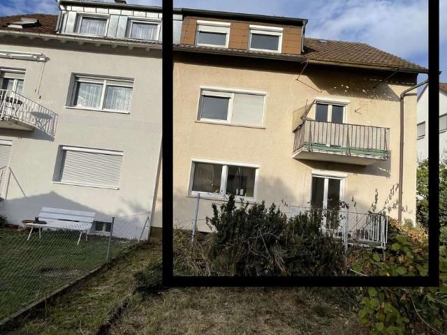Renovierungsbedürftiges Mehrfamilienhaus mit drei Wohneinheiten, Balkonen, Garage und Garten