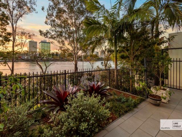Rear River Home. Riverside Luxury with Private Courtyard Showcasing Waterfront Views