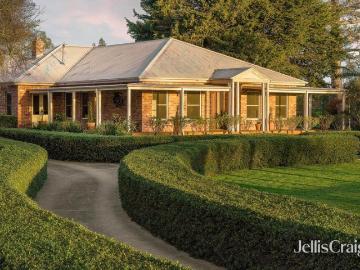 Recycled red brick homestead in idyllic garden surrounds