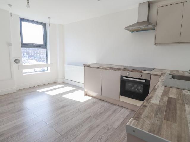 Recently renovated one bedroom flat in town centre location with parking