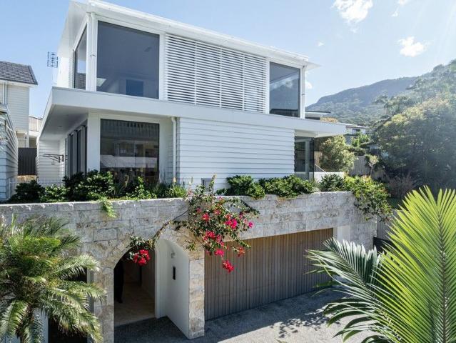 Refined Coastal Living Only Steps from the Sand