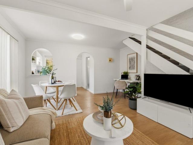 REFRESHED TOWNHOUSE WITH A STANDOUT PRIVATE COURTYARD