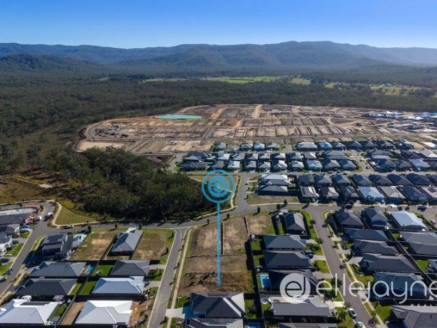 REGISTERED 702M2 BLOCK IN ELEVATED POSITION OF QUIET STREET IN MASTER PLANNED WATAGAN PARK ESTATE COORANBONG