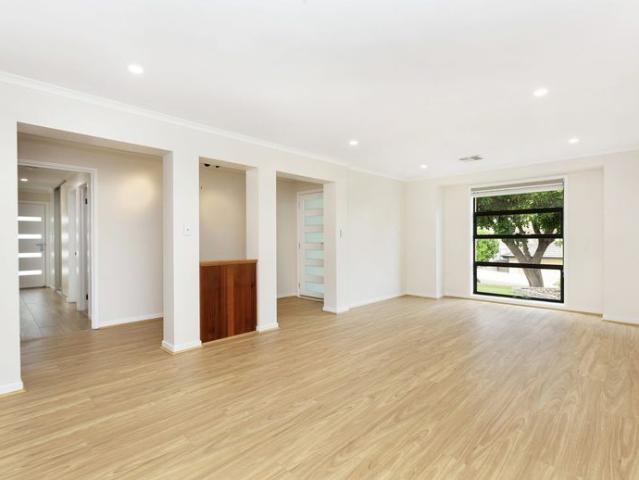Relax, Entertain & Enjoy Modern Family Living Just Minutes from the Coast