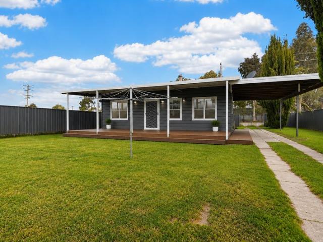 Relax, Entertain & Invest Cottage Charm with Spectacular Views and A Rare Mixed Zoning Opportunity