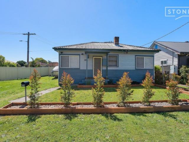 Relax on the rear deck and have a BBQ with your friends and family while the kids play in the yard