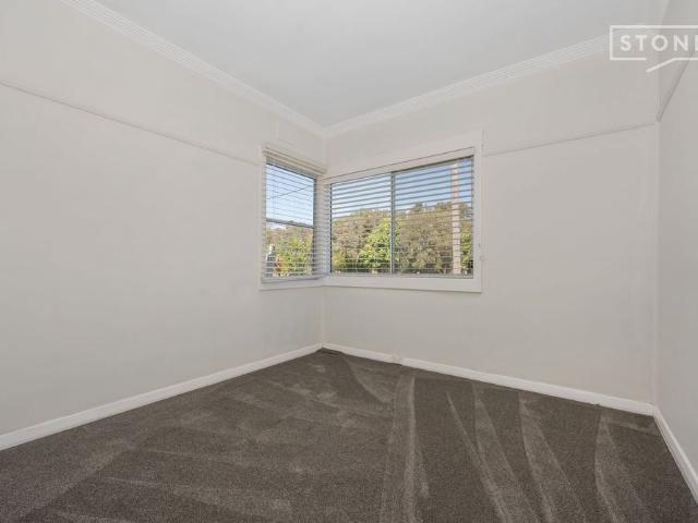 Relax on the rear deck and have a BBQ with your friends and family while the kids play in the yard