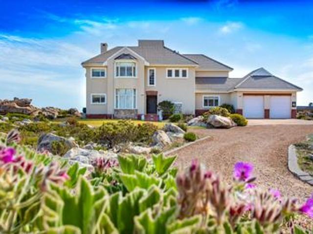 relaxed beachside living, peaceful a.