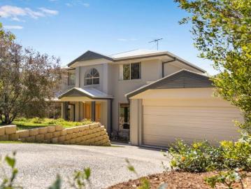 Relaxed Family Living with Study, Lush Outlooks & Creekside Position on 1112sqm