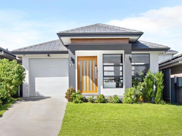 Reserve Facing, Sun Drenched and Custom Built Single Level Family Home!