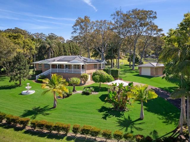 Resort style acreage living in a private garden setting