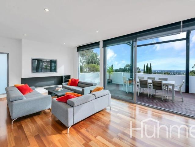 Resort Style Executive Living with Stunning City & Coast Views